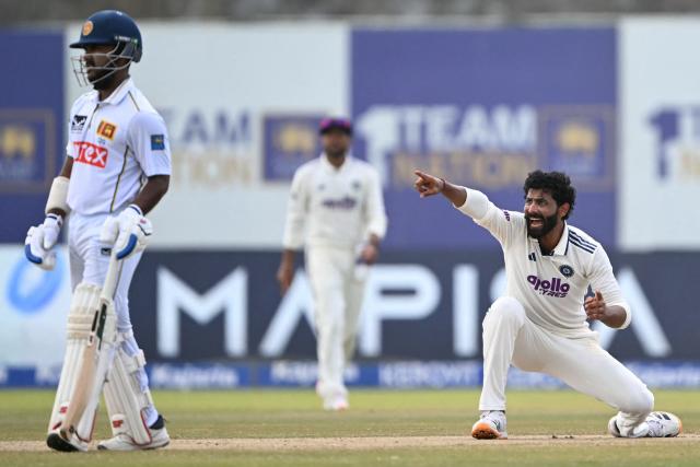 India's Ravindra Jadeja (R) appeals for leg before wicket (LBW) against Sri Lanka's captain Dhananjaya de Silva during the fifth day of the first Test cricket match between Sri Lanka and India at the Galle International Stadium in Galle on August 19, 2026. (Photo by Ishara S. KODIKARA / AFP)