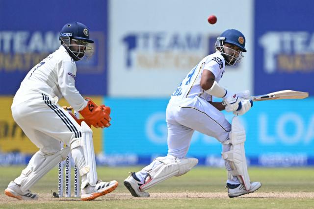Sri Lanka's Sonal Dinusha plays a shot as India's wicketkeeper Rishabh Pant watches during the fifth day of the first Test cricket match between Sri Lanka and India at the Galle International Stadium in Galle on August 19, 2026. (Photo by Ishara S. KODIKARA / AFP)