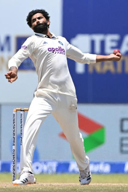 India's Ravindra Jadeja bowls during the fifth day of the first Test cricket match between Sri Lanka and India at the Galle International Stadium in Galle on August 19, 2026. (Photo by Ishara S. KODIKARA / AFP)