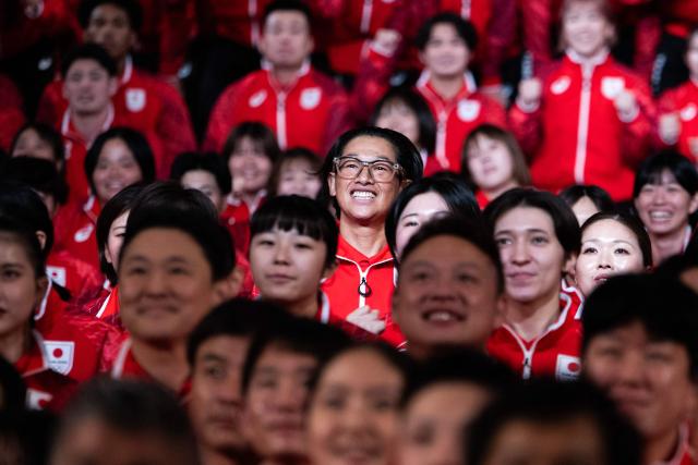 Athletes pose during a team Japan photo after a send off ceremony at the Grand Prince Hotel Shin Takanawa in Tokyo on August 19, 2026. (Photo by ANDREW CABALLERO-REYNOLDS / AFP)