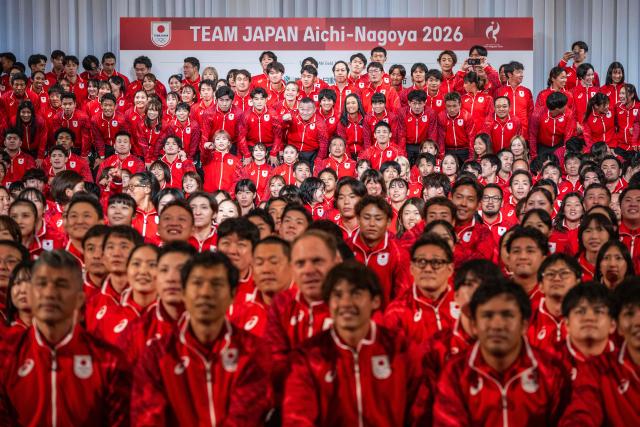 Athletes pose during a team Japan photo after a send off ceremony at the Grand Prince Hotel Shin Takanawa in Tokyo on August 19, 2026. (Photo by ANDREW CABALLERO-REYNOLDS / AFP)