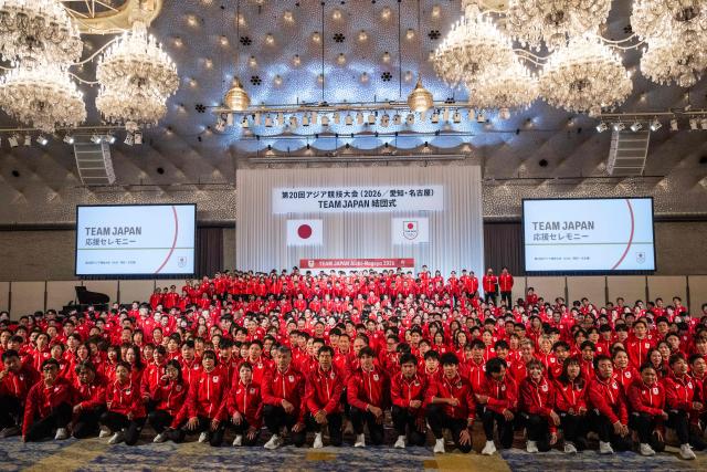 Athletes pose during a team Japan photo after a send off ceremony at the Grand Prince Hotel Shin Takanawa in Tokyo on August 19, 2026. (Photo by ANDREW CABALLERO-REYNOLDS / AFP)