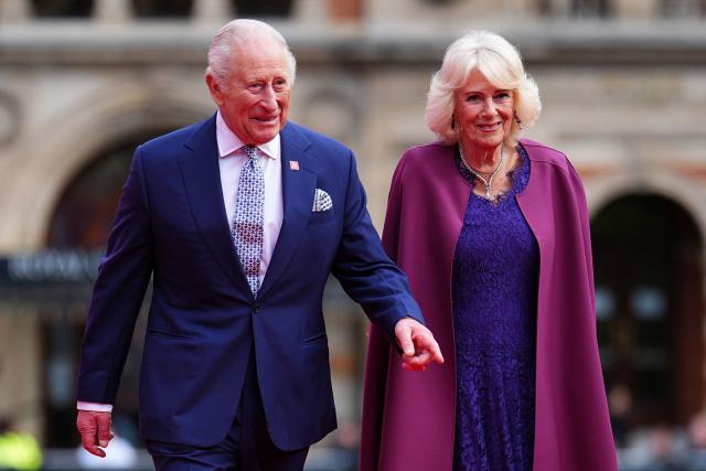 (FILES) Britain's King Charles III (L) and Britain's Queen Camilla arrive to attend the King's Trust 50th anniversary celebration at the Royal Albert Hall in London on May 11, 2026. Queen Camilla on August 19, 2026 has spoken about the difficulty of not revealing King Charles III had cancer when she visited a support charity shortly after her husband had been diagnosed with the disease. (Photo by Aaron Chown / POOL / AFP)