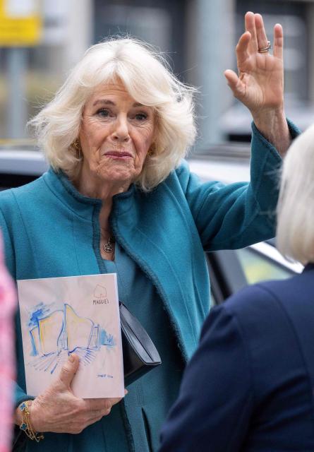 (FILES) Britain's Queen Camilla waves as she leaves after after opening 'Maggie's Royal Free', a new cancer support centre, at the Royal Free Hospital in east London on January 31, 2024. Queen Camilla on August 19, 2026 has spoken about the difficulty of not revealing King Charles III had cancer when she visited a support charity shortly after her husband had been diagnosed with the disease. (Photo by Paul Grover / POOL / AFP)
