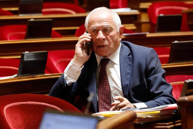 (FILES) Head of the "Renaissance" parliamentary group Senator Francois Patriat uses his phone during a debate on the government's immigration bill in the French Senate in Paris on November 7, 2023. Current senator and president of the "Rassemblement des democrates, progressistes et independants" group in the Senate Francois Patriat died, the parliamentary group announced on August 19, 2026 (Photo by Ludovic MARIN / AFP)