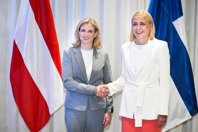 Finnish Foreign Minister Elina Valtonen (R) and Austria's Foreign Minister Beate Meinl-Reisinger shake hands as they meet in Helsinki, Finland, on August 19, 2026. (Photo by Markku Ulander / Lehtikuva / AFP) / Finland OUT