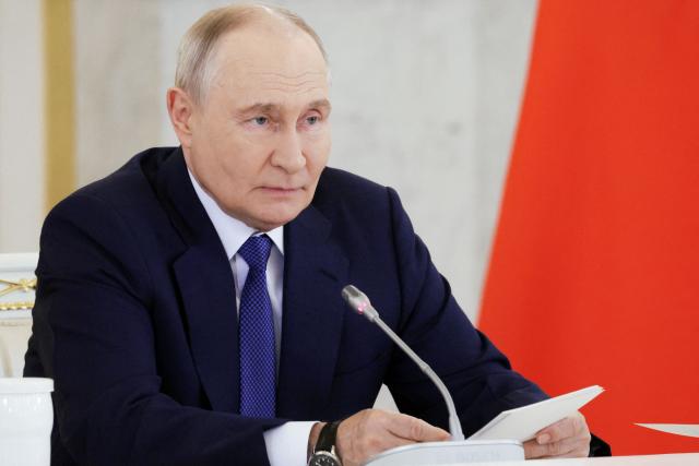 In this pool photograph distributed by the Russian state agency Sputnik, Russia's President Vladimir Putin chairs a meeting of the Council for Strategic Development and National Projects at the Kremlin in Moscow on August 19, 2026. (Photo by Gavriil GRIGOROV / POOL / AFP)