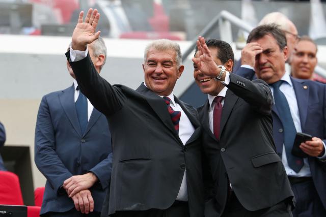 Barcelona's President Joan Laporta (L) waves before the 61st Joan Gamper Trophy football match between FC Barcelona and Al Ahly FC at the Camp Nou Stadium in Barcelona on August 19, 2026. (Photo by Lluis GENE / AFP)