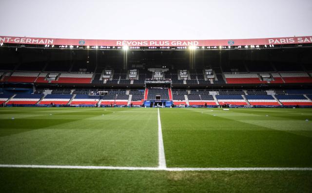 (FILES) A picture shows the empty stands and pitch before the French Cup round of 16 football match between Paris Saint-Germain (PSG) and Lille (LOSC) at the Parc des Princes stadium in Paris, on March 17, 2021. The first Ligue 1 match of the season for PSG, the reigning French champions, originally scheduled for August 23, 2026 at the Parc des Princes against Rennes, will instead take place at Roazhon Park due to the poor condition of the pitch at the Parisian stadium, the LFP announced on August 19, 2026. (Photo by FRANCK FIFE / AFP)