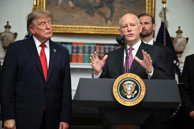 Jeffrey Sprecher, chairman of the New York Stock Exchange (NYSE), speaks next to US President Donald Trump during a meeting with cryptocurrency executives in the Roosevelt Room of the White House in Washington, DC, on August 19, 2026. (Photo by Jim WATSON / AFP)