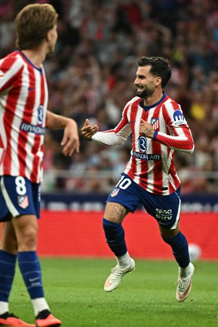 Atletico Madrid's Spanish forward #10 Alex Baena celebrates scoring their second goal during the Spanish league football match between Club Atletico de Madrid and Malaga CF at the Metropolitano Stadium in Madrid on August 19, 2026. (Photo by Javier SORIANO / AFP)