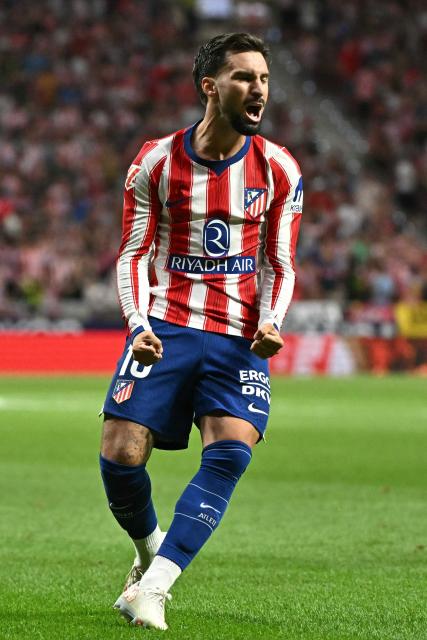 Atletico Madrid's Spanish forward #10 Alex Baena celebrates scoring their second goal during the Spanish league football match between Club Atletico de Madrid and Malaga CF at the Metropolitano Stadium in Madrid on August 19, 2026. (Photo by Javier SORIANO / AFP)