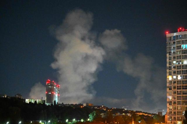 Smoke rises from missiles launched by Russia, in Kyiv, Ukraine, on August 19, 2026. (Photo by Sergei SUPINSKY / AFP)
