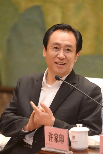 (FILES) This photo taken on June 5, 2017 shows Evergrande's president Xu Jiayin, also known as Hui Ka Yan in Cantonese, attending a meeting in Wuhan, in China's central Hubei province. A Chinese court on August 20, 2026 fined embattled property giant Evergrande billions of yuan and sentenced its founder Xu Jiayin to life in prison. (Photo by CN-STR / AFP) / China OUT
