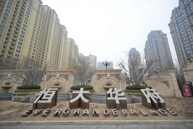 (FILES) A general view shows the entrance of the Evergrande Group residential complex called Evergrande Palace in Beijing on January 30, 2024. A Chinese court on August 20, 2026 fined embattled property giant Evergrande billions of yuan and sentenced its founder Xu Jiayin to life in prison. (Photo by Pedro PARDO / AFP)