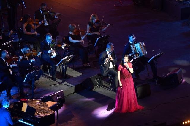 Lebanese singer Majida El Roumi performs during the closing ceremony of the 60th session of the International Festival of Carthage (FIC) at the Carthage Roman Theatre on the outskirts of Tunis on August 19, 2026. (Photo by FETHI BELAID / AFP)