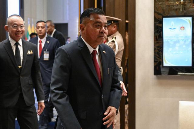 Myanmar’s military commander-in-chief, General Ye Win Oo (C) and Thailand’s Chief of Defence Forces, Ukrit Boontanon (L) leave after their High-Level Committee Meeting talks at the Chatrium Grand hotel in Bangkok on August 20, 2026. (Photo by ANTHONY WALLACE / AFP)