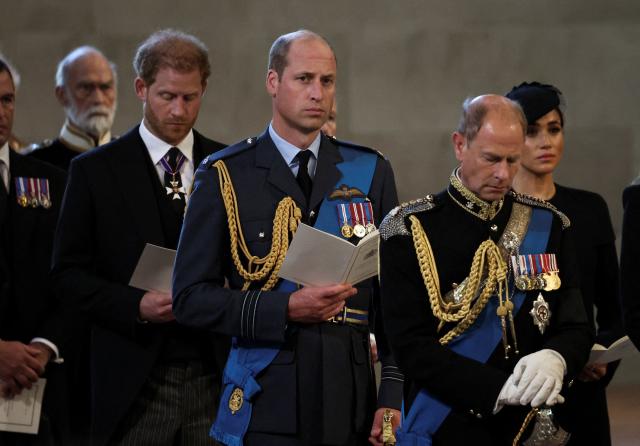 (FILES) Britain's Prince William, Prince of Wales (C), Britain's Prince Harry, Duke of Sussex (L) Britain's Prince Edward, Earl of Wessex and Meghan, Duchess of Sussex attend a service for the reception of Queen Elizabeth II's coffin at Westminster Hall, in the Palace of Westminster in London on September 14, 2022, where the coffin will lie in State. Prince Harry and his wife Meghan, who cut ties with the British royal family in 2020, are moving back to the United Kingdom, British press reported on August 19, 2026. In a surprise move, the youngest son of King Charles III and Meghan, "plan to leave the United States by the end of the month to settle in a private, non-royal residence, which is said to be located outside London," The Telegraph said. (Photo by ALKIS KONSTANTINIDIS / POOL / AFP)