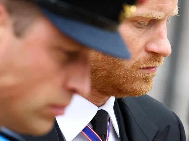 (FILES) Britain's Prince William, Prince of Wales (L) and Britain's Prince Harry, Duke of Sussex (R) attend the State Funeral of Britain's Queen Elizabeth II in London on September 19, 2022. Prince Harry and his wife Meghan, who cut ties with the British royal family in 2020, are moving back to the United Kingdom, British press reported on August 19, 2026. In a surprise move, the youngest son of King Charles III and Meghan, "plan to leave the United States by the end of the month to settle in a private, non-royal residence, which is said to be located outside London," The Telegraph said. (Photo by HANNAH MCKAY / POOL / AFP)