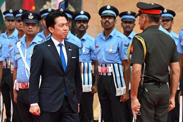 Japan’s Defence Minister Shinjiro Koizumi inspects the guard of honour at the Manekshaw Centre in New Delhi on August 20, 2026. (Photo by Sajjad HUSSAIN / AFP)