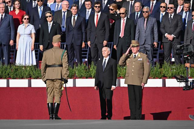 Hungarian President Andras Baka (C) inspects the honour guard during a ceremony marking the country's national day attended by guests and ambassadors accredited to Hungary on August 20, 2026, in Budapest. Hungary marks the 1,026th anniversary of the foundation of the Hungarian state, established by the first king of Hungary, Stephen I.  Hungarian President Andras Baka, who took office yesterday, makes his first public appearance since then. (Photo by Attila KISBENEDEK / AFP)