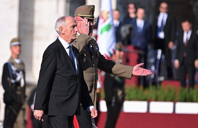 Hungarian President Andras Baka (L) inspects the honour guard during a ceremony marking the country's national day attended by guests and ambassadors accredited to Hungary on August 20, 2026, in Budapest. Hungary marks the 1,026th anniversary of the foundation of the Hungarian state, established by the first king of Hungary, Stephen I.  Hungarian President Andras Baka, who took office yesterday, makes his first public appearance since then. (Photo by Attila KISBENEDEK / AFP)
