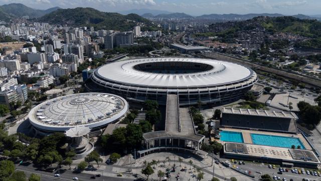 (FILES) Aerial view of the Maracana stadium in Rio de Janeiro, Brazil on May 7, 2025. The Maracana will further cement its place in history as a footballing mecca: the Rio de Janeiro stadium will host the opening match and the final of the 2027 Women’s World Cup, the first to be held in South America, FIFA announced on August 20, 2026. (Photo by Pablo PORCIUNCULA / AFP)