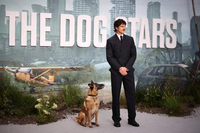 US actor Jacob Elordi poses with a dog who plays Jasper in the film upon arrival on the red carpet for the world premiere of the film 'The Dog Stars', in central London on August 20, 2026. (Photo by Henry Nicholls / AFP)