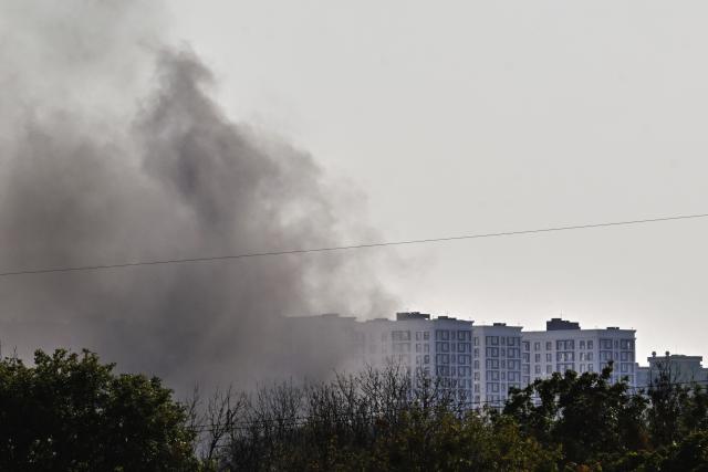 This photograph shows smoke rising following a drone strike in Kyiv, on August 20, 2026, amid the Russian invasion of Ukraine. (Photo by Sergei SUPINSKY / AFP)