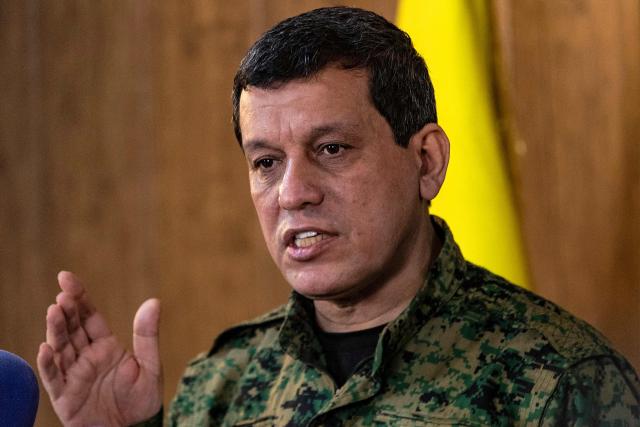 (FILES) Syrian Democratic Forces (SDF) commander-in-chief Mazloum Abdi, speaks during a press conference in Syria's northeastern city of Hasakeh on December 6, 2024. Syrian Kurdish leader Abdi said on August 20, 2026 that the integration of the Kurdish administration within Syria's state institutions was complete, nearly eight months after an agreement on the matter was reached. (Photo by Delil SOULEIMAN / AFP)