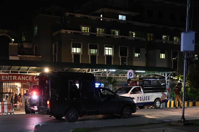 Security personnel cordon off a street outside the Shifa International Hospital in Islamabad on August 20, 2026 after Pakistan's Supreme Court ordered to transfer jailed former prime minister Imran Khan to hospital for medical treatment. Pakistan's Supreme Court ordered on August 18 that Khan be moved to hospital for medical checks, after a petition by his lawyers over claims of poor health. (Photo by Aamir QURESHI / AFP)
