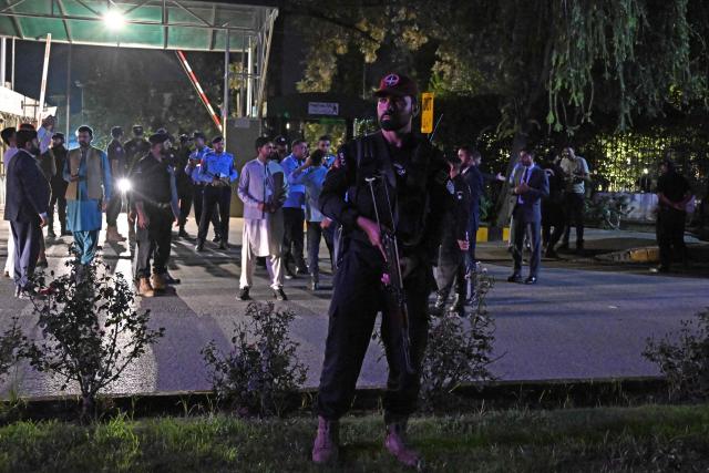 Security personnel gather as they cordon off a street outside the Shifa International Hospital in Islamabad on August 20, 2026 after Pakistan's Supreme Court ordered to transfer jailed former prime minister Imran Khan to hospital for medical treatment. Pakistan's Supreme Court ordered on August 18 that Khan be moved to hospital for medical checks, after a petition by his lawyers over claims of poor health. (Photo by Aamir QURESHI / AFP)