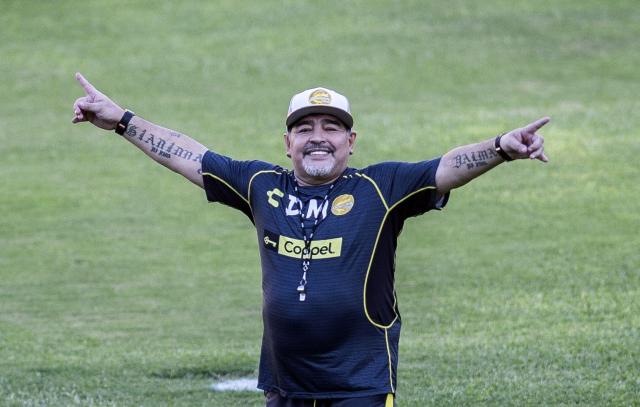 (FILES) Argentine legend Diego Maradona gestures during his first training session as coach of Mexican football club Dorados, at the Banorte stadium in Culiacan, Sinaloa State, Mexico, on September 10, 2018. The trial over the death of football legend Diego Maradona has been postponed for a week, until August 27, to verify whether incorrect medical tests were used in the expert reports, the court announced on August 20, 2026. (Photo by Pedro PARDO / AFP)
