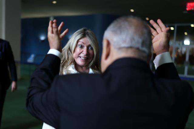 Ivonne A-Baki is greeted after speaking with reporters following a hearing to be considered as a candidate to the position of Secretary-General of the United Nations at UN headquarters in New York on August 20, 2026. Ecuador's Ivonne A-Baki, a diplomat who represented Quito in the United States, has entered the race to lead the UN, the head of the General Assembly said in a letter on August 18. Nominated by Tonga, the former foreign trade minister joins a growing field of candidates for secretary-general of the international organization, which has been buffeted by global divisions and budget issues. (Photo by CHARLY TRIBALLEAU / AFP)