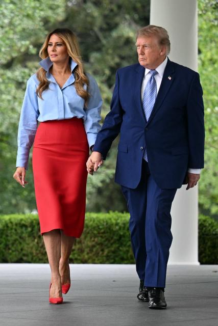 US President Donald Trump and US First Lady Melania Trump arrive to host an event with IndyCar and FOX Sports to expand academic opportunities for individuals transitioning from foster care, in the Rose Garden of the White House, in Washington, DC, on August 20, 2026. (Photo by Jim WATSON / AFP)