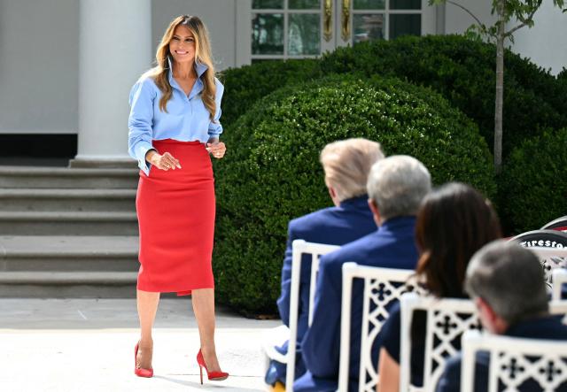 US First Lady Melania Trump returns to her seat afer speaking at an event with IndyCar and FOX Sports to expand academic opportunities for individuals transitioning from foster care, in the Rose Garden of the White House, in Washington, DC, on August 20, 2026. (Photo by Jim WATSON / AFP)