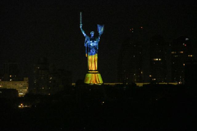 This photograph shows a light and audiovisual installation "The Future Remembers" projected on the Motherland Monument to mark the 35th anniversary of Ukraine's independence in Kyiv on August 20, 2026, amid Russia’s invasion of Ukraine. (Photo by Evgen KOTENKO / AFP)