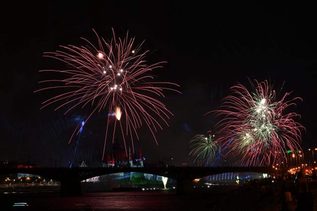 Fireworks explode over the Danube River in front of the Hungarian Parliament building as part of celebrations marking Hungary's National Day, in Budapest, on August 20, 2026. Hungary celebrated the 1,026th anniversary of the foundation of the Hungarian state, established by the first king of Hungary, Stephen I. (Photo by Attila KISBENEDEK / AFP)
