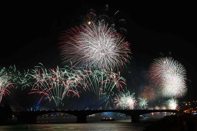 Fireworks explode over the Danube River in front of the Hungarian Parliament building as part of celebrations marking Hungary's National Day, in Budapest, on August 20, 2026. Hungary celebrated the 1,026th anniversary of the foundation of the Hungarian state, established by the first king of Hungary, Stephen I. (Photo by Attila KISBENEDEK / AFP)