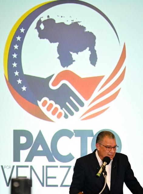 Venezuelan former presidential candidate and political ex-prisoner Enrique Marquez speaks at a press conference to present his “Pact for Venezuela” proposal in Caracas on August 20, 2026. (Photo by Juan BARRETO / AFP)
