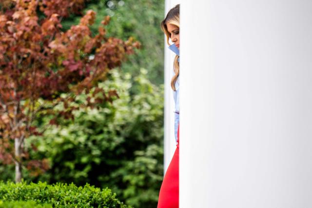 US First Lady Melania Trump walks out between the columns of the colonnade as she arrives to host an event with IndyCar and FOX Sports to expand academic opportunities for individuals transitioning from foster care, in the Rose Garden of the White House, in Washington, DC, on August 20, 2026. (Photo by Jim WATSON / AFP)