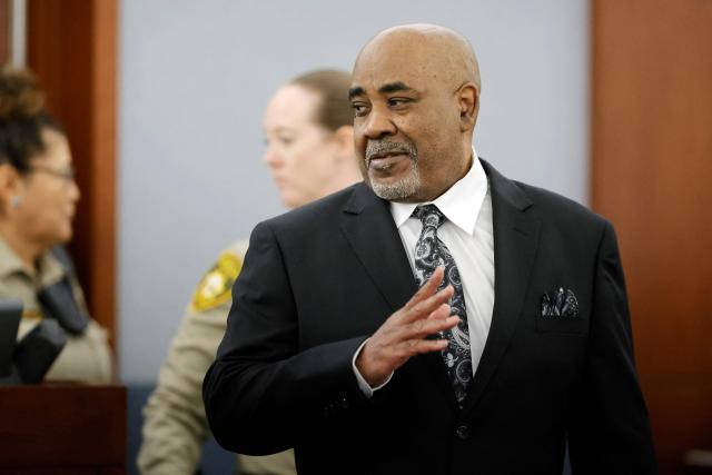 Duane Davis enters the courtroom during his murder trial, related to the 1996 killing of rapper Tupac Shakur, at Clark County District Court at the Regional Justice Center in Las Vegas, Nevada, on August 20, 2026. The trial of the former gang leader accused of orchestrating the murder of rapper Tupac Shakur began on August 10, 30 years after one of America's most high-profile unresolved killings. The proceedings, expected to last a month, will likely not make clear who fired the shots that killed the California hip-hop legend on the night of September 7, 1996, while he was in Las Vegas to see a Mike Tyson boxing match. (Photo by Steve Marcus / POOL / AFP)