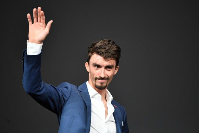 (FILES) French cyclist Julian Alaphilippe arrives to take part in the official presentation of the 2022 Tour de France cycling race, in Paris, on October 14, 2021. French cyclist Julian Alaphilippe, a two-time world champion and winner of Milan–Sanremo, is set to retire at the age of 34, according to reports on August 20, 2026 evening, including in the daily newspaper L'Equipe. (Photo by Anne-Christine POUJOULAT / AFP)