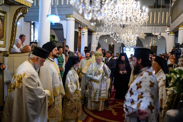 Ecumenical Patriarch Bartholomew I of Greek Orthodox Church performs a blessing during the Feast of the Dormition of the Virgin Mary, on Gokceada (Imroz) Island, Çanakkale Province of Turkey, on August 15, 2026. Hundreds of Greeks return from Athens and around the world to Imbros each August 15 to celebrate the Virgin Mary. Like Istanbul and nearby Tenedos, the island was exempt from the 1923 population exchange between Greece and Turkey, which displaced more than 1.5 million people. (Photo by Yasin AKGUL / AFP)