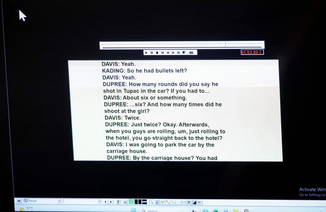 A screen shows a transcript of a 2008 recording of an interview with Duane Davis and Los Angeles Police Department detectives as it is played during Davis's murder trial, related to the 1996 killing of rapper Tupac Shakur, in Clark County District Court at the Regional Justice Center on  in Las Vegas, Nevada, on August 20, 2026. The trial of the former gang leader accused of orchestrating the murder of rapper Tupac Shakur began on August 10, 30 years after one of America's most high-profile unresolved killings. The proceedings, expected to last a month, will likely not make clear who fired the shots that killed the California hip-hop legend on the night of September 7, 1996, while he was in Las Vegas to see a Mike Tyson boxing match. (Photo by Steve Marcus / POOL / AFP)