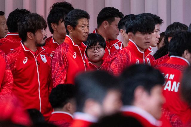 11-year-old Yuki Kurihara (C), looks on past other athletes as he waits for a team Japan photo after a send off ceremony for the 2026 Asian Games Japan team at the Grand Prince Hotel Shin Takanawa in Tokyo on August 19, 2026. Yuki Kurihara will become Japan's youngest athlete in Asian Games history next month and the 11-year-old eSports whizz-kid wants to be the competition's youngest ever medallist too. (Photo by ANDREW CABALLERO-REYNOLDS / AFP)