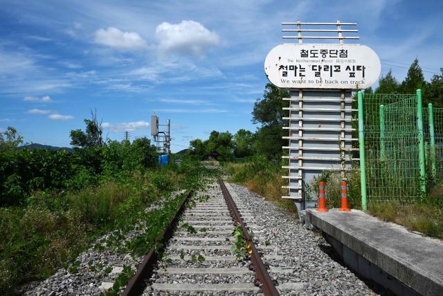 TOPSHOT - Train tracks are seen at the Baengmagoji Station in Cheorwon, Gangwon Province in South Korea, near the demilitarized zone separating North and South Korea on August 10, 2026. Plans to reconnect South Korea's northernmost station to the rail network come at an awkward moment, as Pyongyang ignores Seoul's overtures while the South's old ally Washington pursues its own talks with Pyongyang. (Photo by GREG BAKER / AFP) / To go with 'Skorea-Nkorea-US-Diplomacy-Politics' Focus by Jihye SHIN