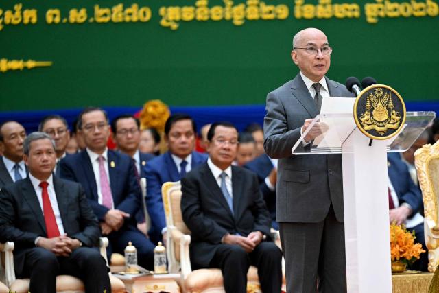 Cambodia's King Norodom Sihamoni (R) speaks as Cambodian Senate President Hun Sen (C) and Cambodia's Prime Minister Hun Manet (L) listen during the inauguration ceremony of the new Senate building, known as Solidarity Palace, in Phnom Penh on August 21, 2026. (Photo by TANG CHHIN Sothy / AFP)
