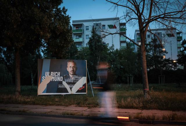 A partially torn off election poster of main candidate in the Saxony-Anhalt state election for the far-right Alternative for Germany (AfD) party Ulrich Siegmund is pictured in Magdeburg, eastern Germany, on August 20, 2026. Regional elections in the eastern federal state of Saxony-Anhalt will take place on September 6, 2026. (Photo by Ronny HARTMANN / AFP)