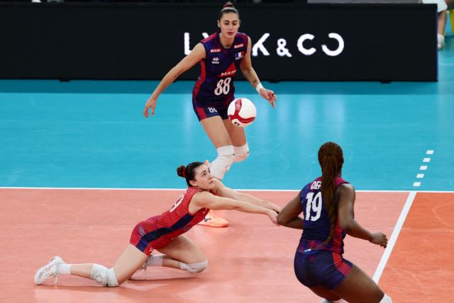 France's Amelie Rotar, Juliette Gelin and Cyrielle Depie play the ball during the women's EuroVolley 2026 European Championship pool D volleyball match between France and Slovakia at the Scandinavium arena in Gothenburg, Sweden, on August 21, 2026. (Photo by Adam Ihse/TT / TT NEWS AGENCY / AFP) / Sweden OUT